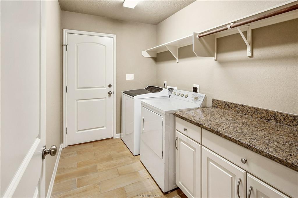 2027 Stubbs Drive Bryan, TX 77807 - Photo 16 of 23 Washroom featuring baseboards, washing machine and