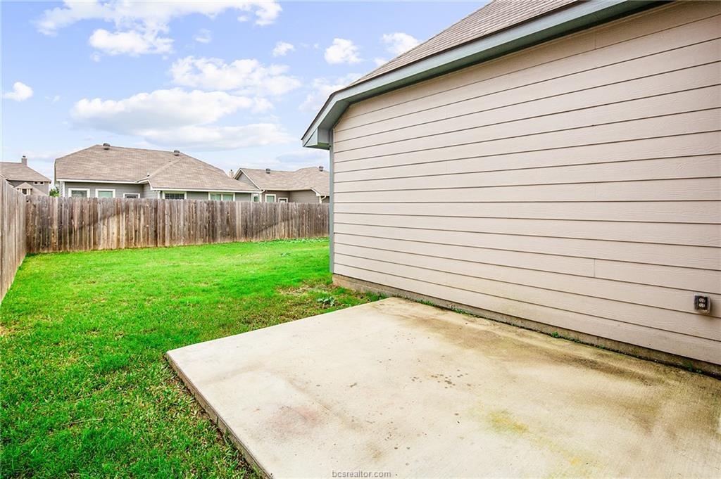 2027 Stubbs Drive Bryan, TX 77807 - Photo 20 of 23 View of yard featuring a patio and a fenced backya