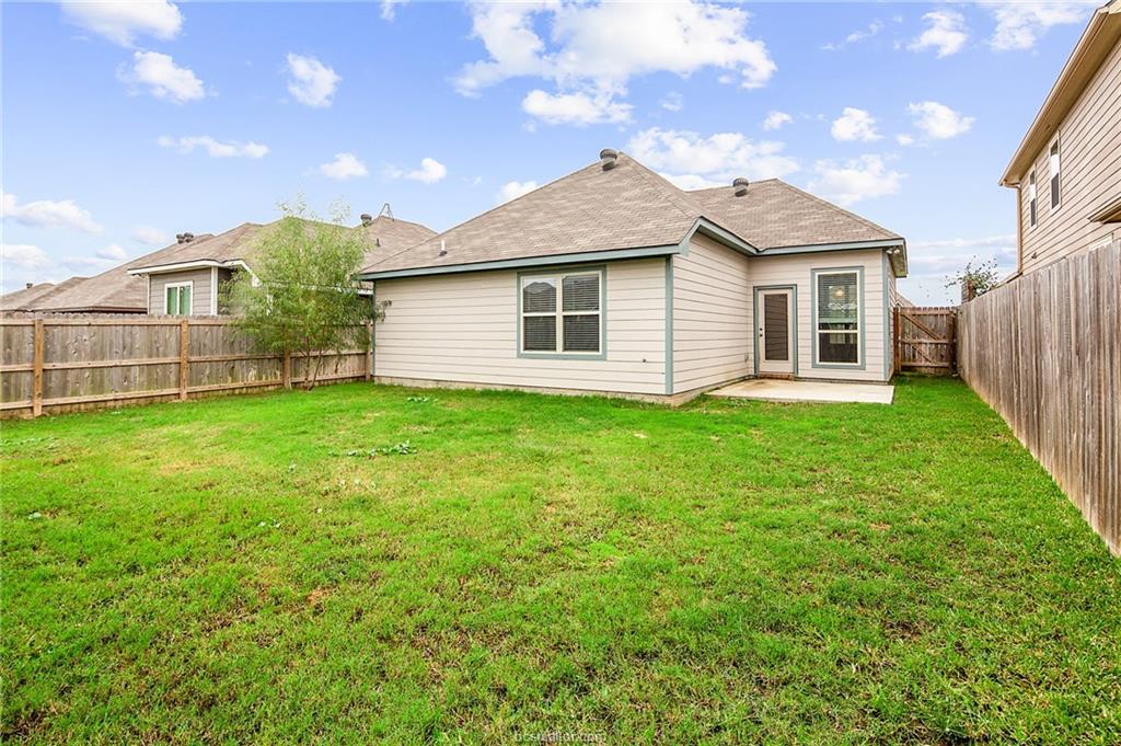 2027 Stubbs Drive Bryan, TX 77807 - Photo 22 of 23 Back of house featuring a fenced backyard, a yard,