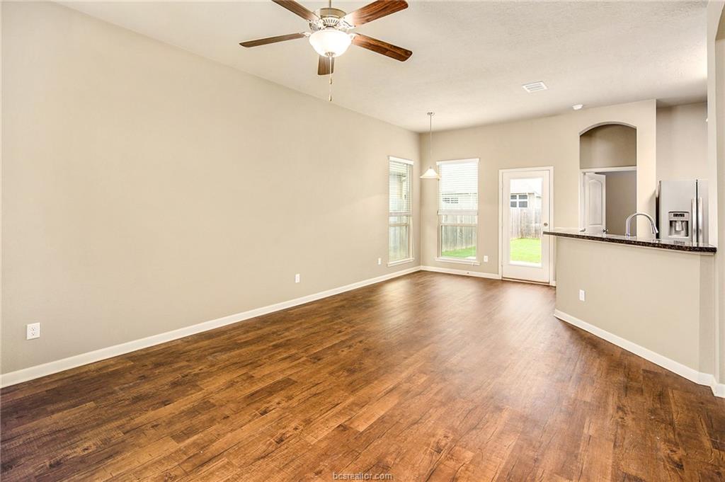 2027 Stubbs Drive Bryan, TX 77807 - Photo 4 of 23 Unfurnished living room with a ceiling fan, a sink