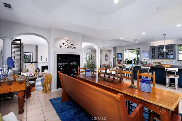 a spacious bedroom with a bed and wooden floor