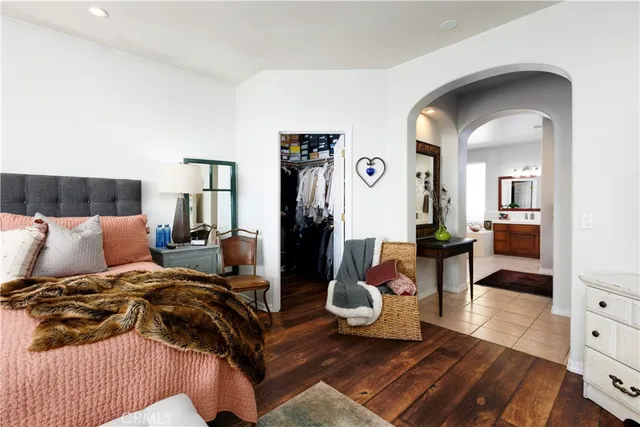 a en suite bathroom with a sink double vanity and a mirror