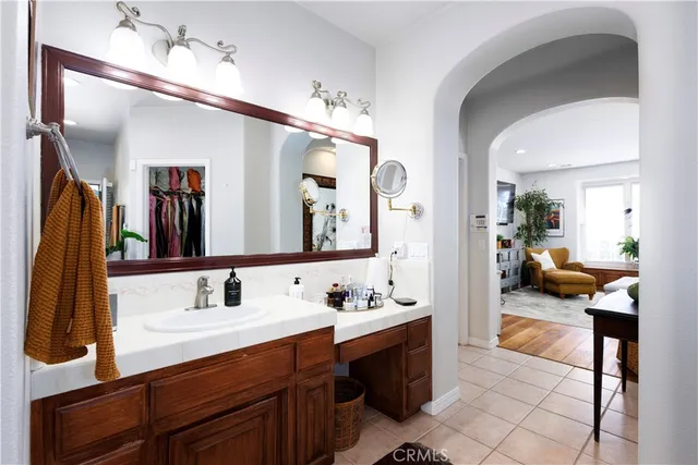 a living room with furniture a rug and a flat screen tv