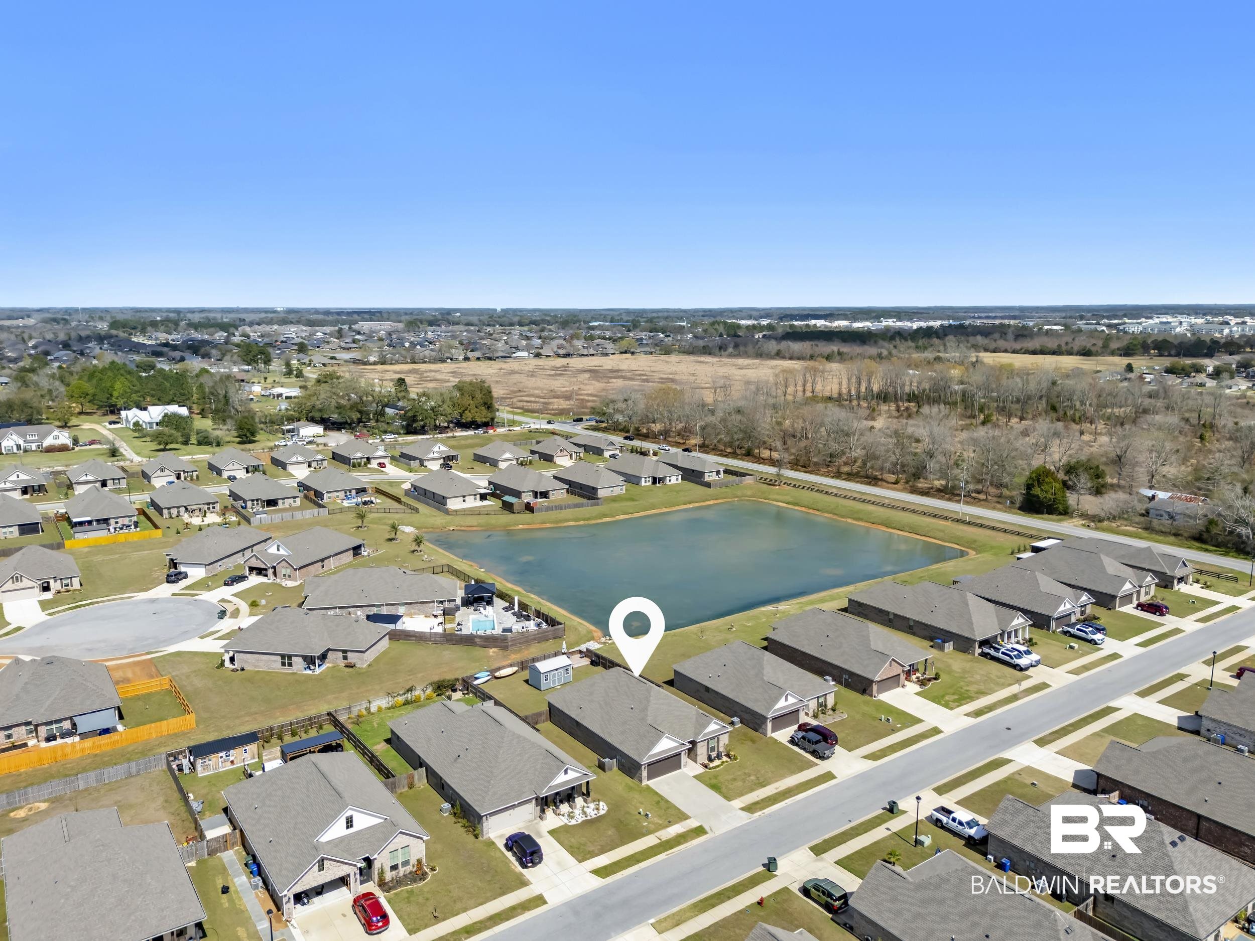 1176 Stella Road Foley, AL 36535 - Photo 30 of 40 Aerial perspective of suburban area featuring a large body of water