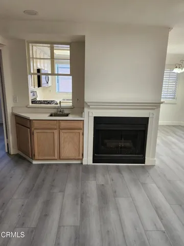 a kitchen with a refrigerator stove and microwave