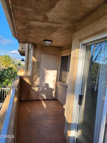 a picture of a building with a tree in front