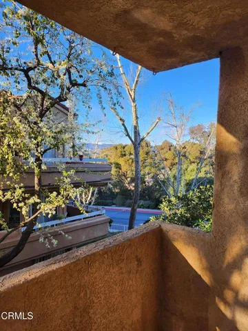 a side view of a house with a street