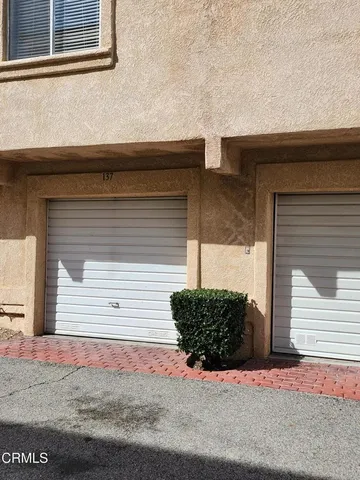 a view of a house with a street