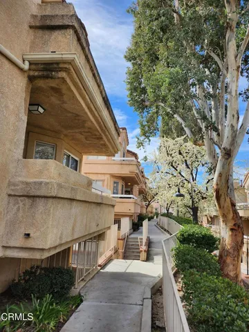 a view of backyard with swimming pool