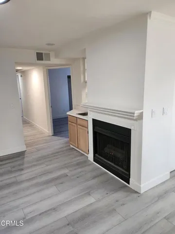 a view of kitchen with granite countertop a stove top oven and sink
