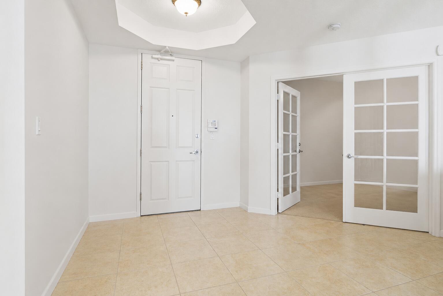 131 Ocean Grande Boulevard, Unit 703 Jupiter, FL 33477 - Photo 18 of 82 VIEW FROM HALLWAY OF ENTRY NO FURNITURE