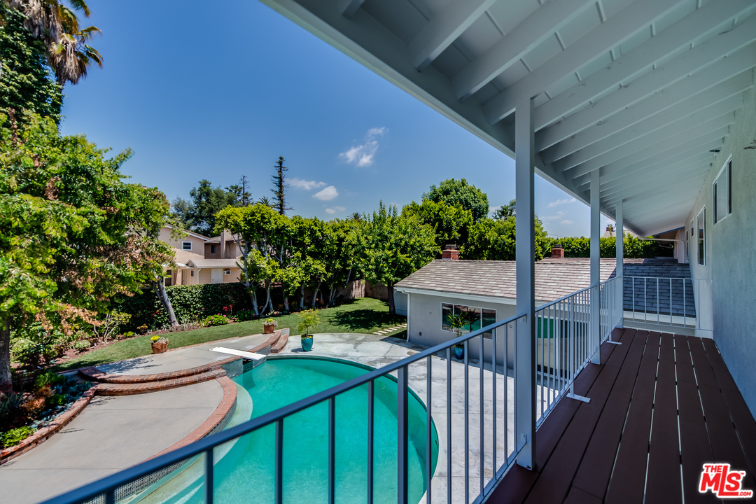 13133 Morrison Street Sherman Oaks, CA 91423 - Photo 16 of 26 a view of a deck and yard with wooden fence