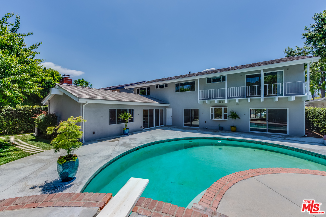 13133 Morrison Street Sherman Oaks, CA 91423 - Photo 24 of 26 a front view of house with a garden and patio
