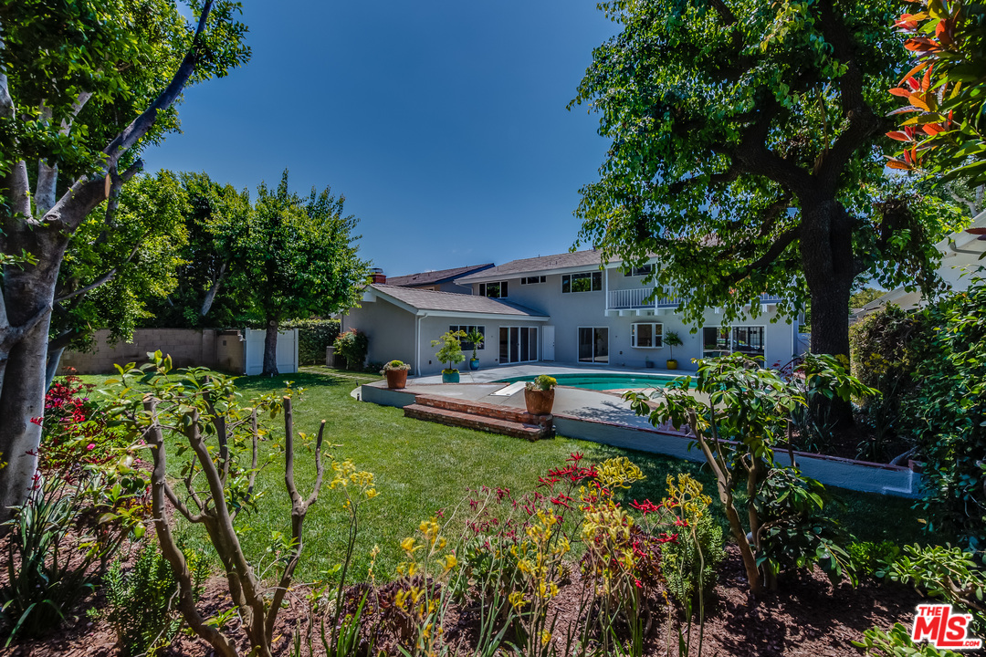 13133 Morrison Street Sherman Oaks, CA 91423 - Photo 25 of 26 a front view of house with a garden