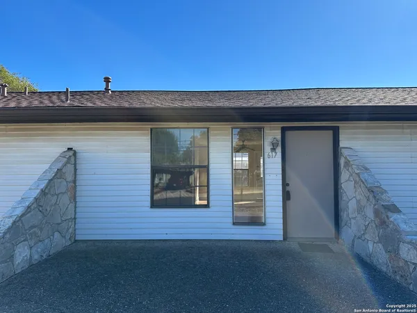 a front view of a house with yard