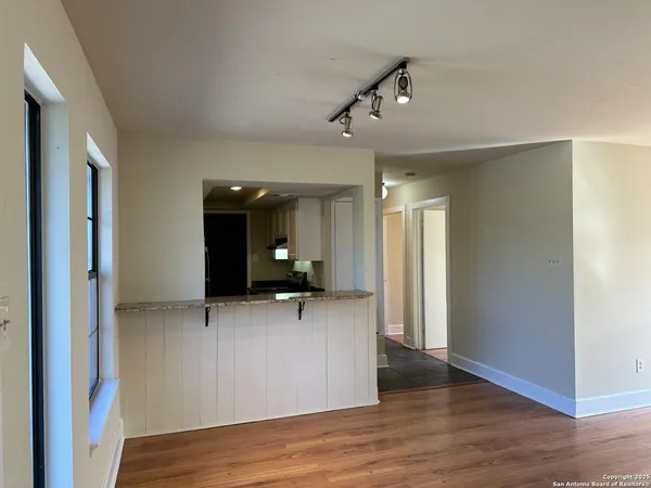 a view of a livingroom with a hallway