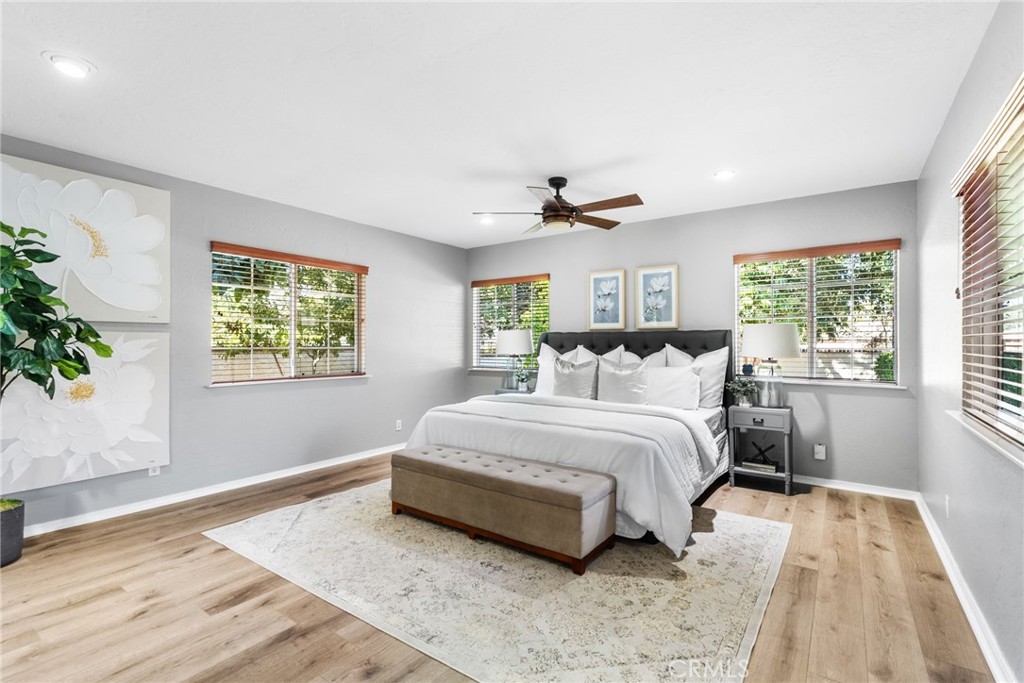 4651 Emerson Street Riverside, CA 92506 - Photo 11 of 30 a spacious bedroom with a large bed and a window