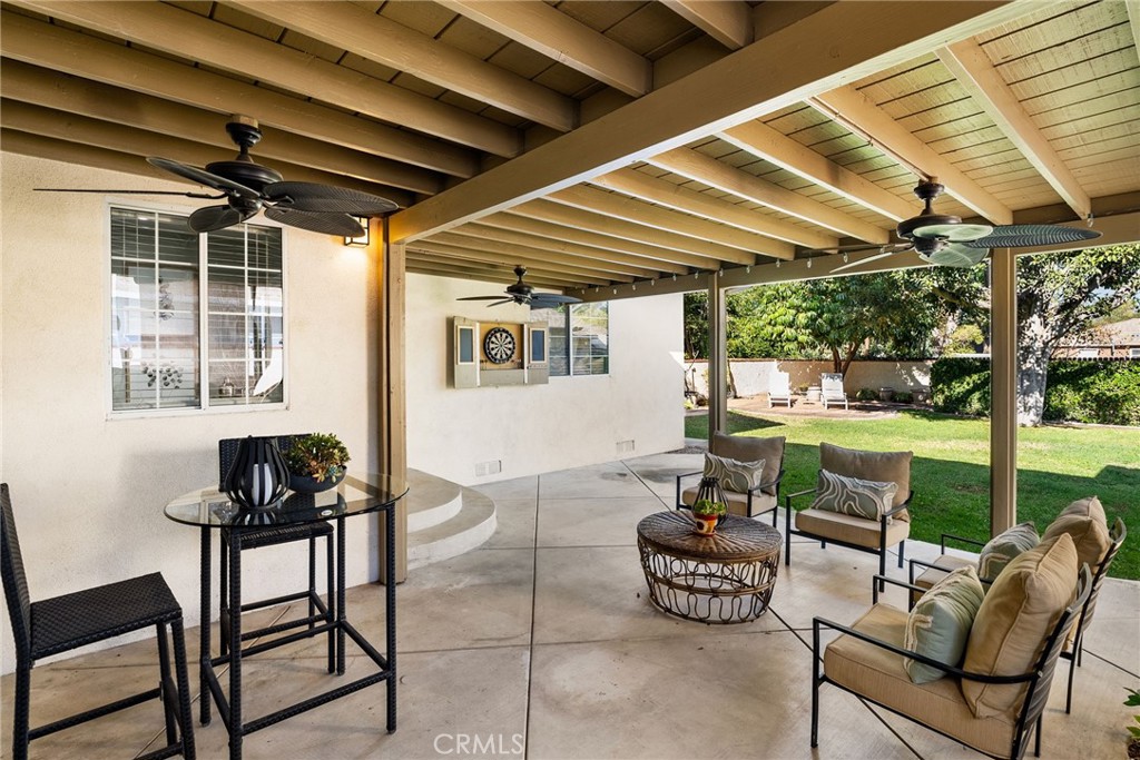 4651 Emerson Street Riverside, CA 92506 - Photo 20 of 30 a dining room with furniture and a floor to ceiling window