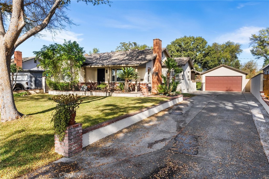 4651 Emerson Street Riverside, CA 92506 - Photo 23 of 30 a front view of a house with a yard