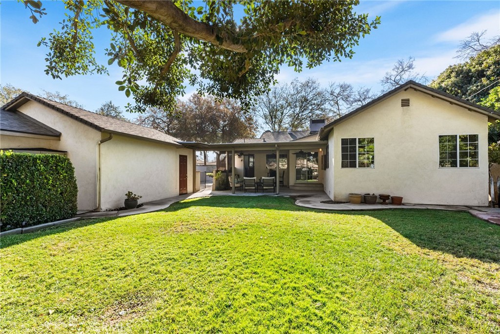 4651 Emerson Street Riverside, CA 92506 - Photo 28 of 30 a view of a house with a yard and a patio