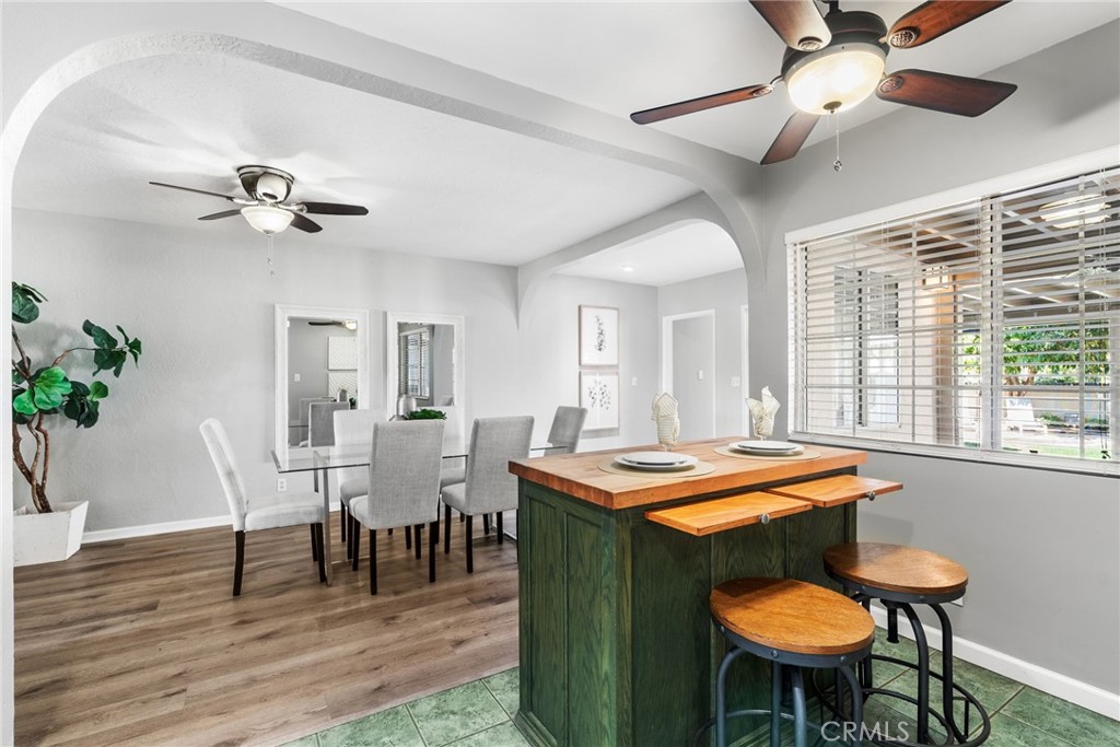 4651 Emerson Street Riverside, CA 92506 - Photo 10 of 30 a dining room with furniture a window and a chandelier