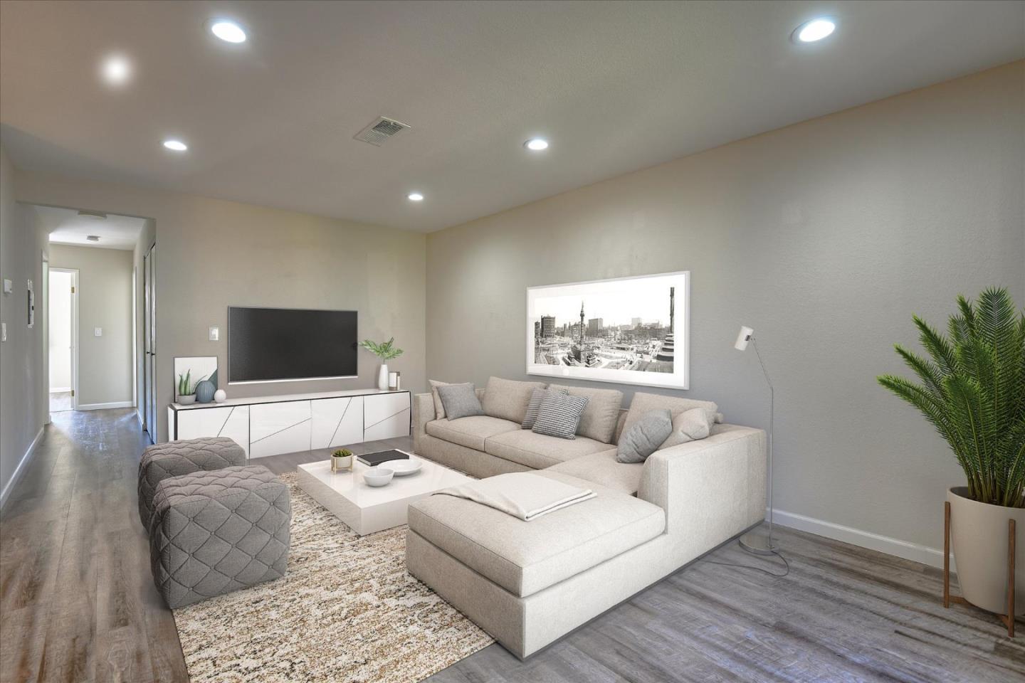 46948 Shale Common, Unit 112 Fremont, CA 94539 - Photo 12 of 30 a living room with furniture and a flat screen tv