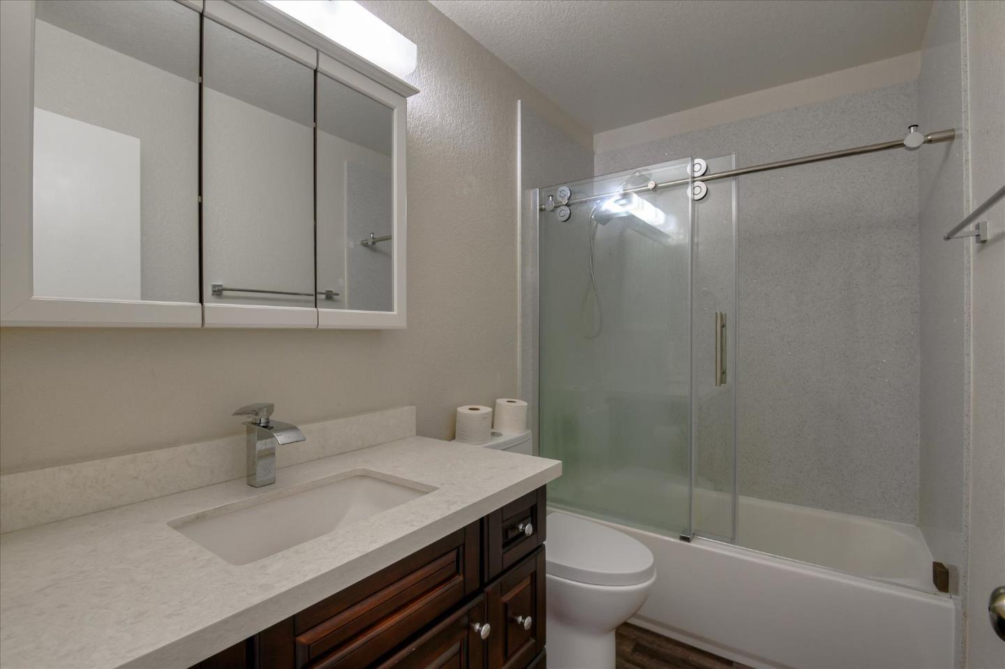 46948 Shale Common, Unit 112 Fremont, CA 94539 - Photo 15 of 30 a bathroom with a sink a toilet and shower