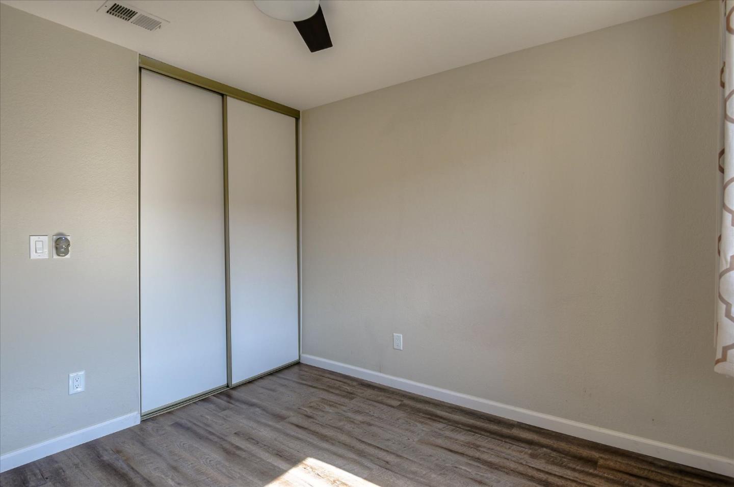 46948 Shale Common, Unit 112 Fremont, CA 94539 - Photo 17 of 30 a view of an empty room with wooden floor