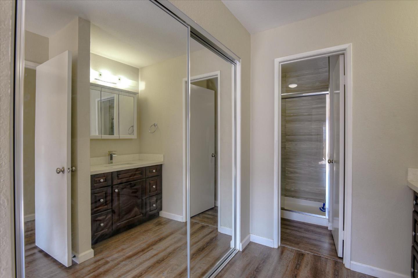46948 Shale Common, Unit 112 Fremont, CA 94539 - Photo 18 of 30 a bathroom with a sink and a mirror