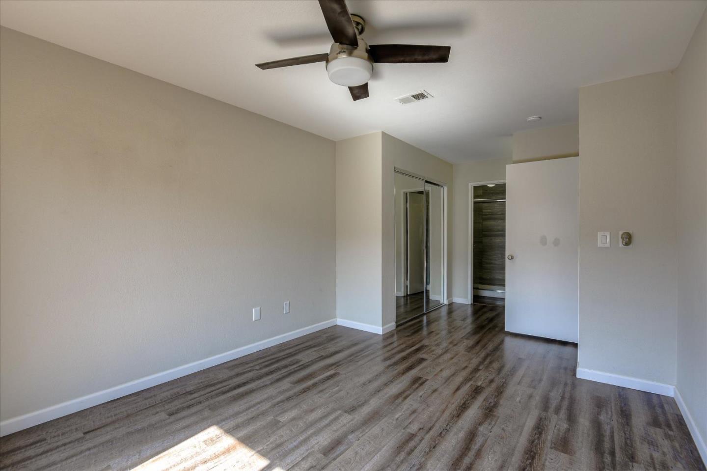 46948 Shale Common, Unit 112 Fremont, CA 94539 - Photo 19 of 30 a view of an empty room with wooden floor