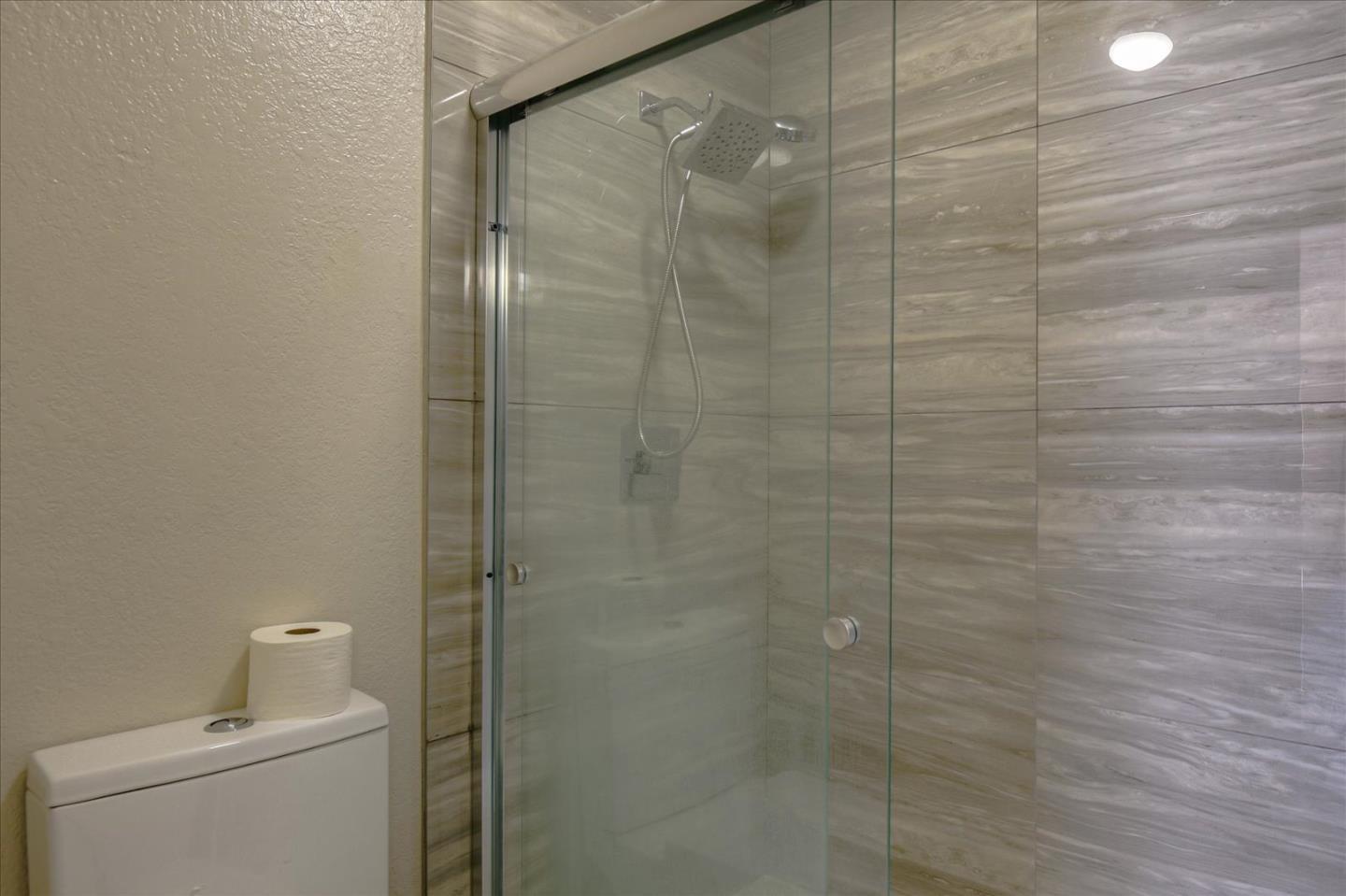 46948 Shale Common, Unit 112 Fremont, CA 94539 - Photo 24 of 30 a bathroom with a shower