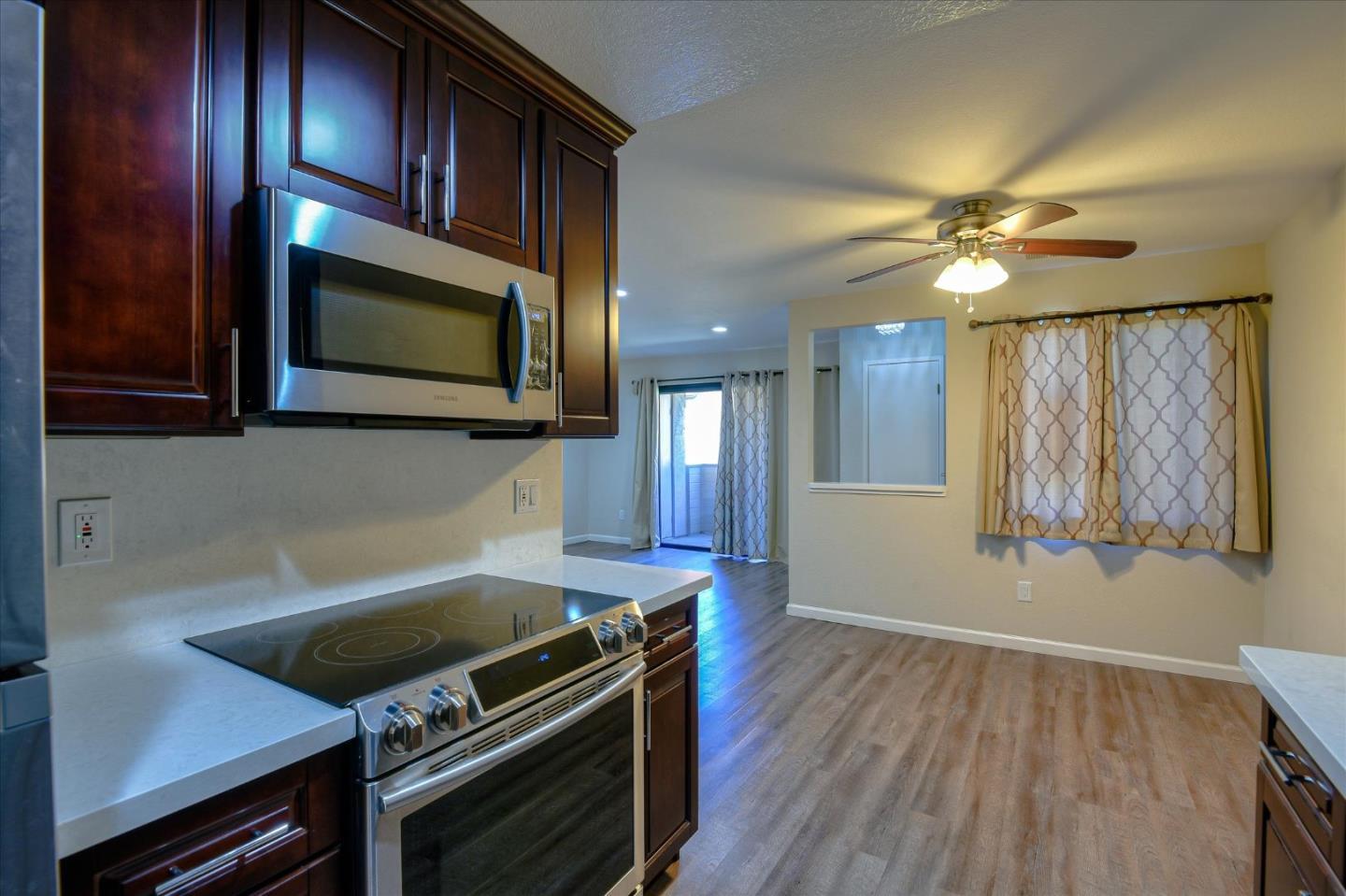 46948 Shale Common, Unit 112 Fremont, CA 94539 - Photo 6 of 30 a kitchen with a stove oven and cabinets