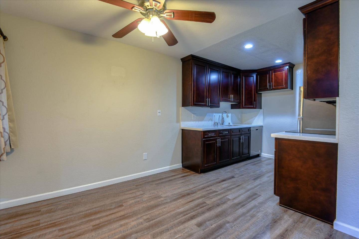 46948 Shale Common, Unit 112 Fremont, CA 94539 - Photo 8 of 30 a kitchen with a refrigerator and a sink