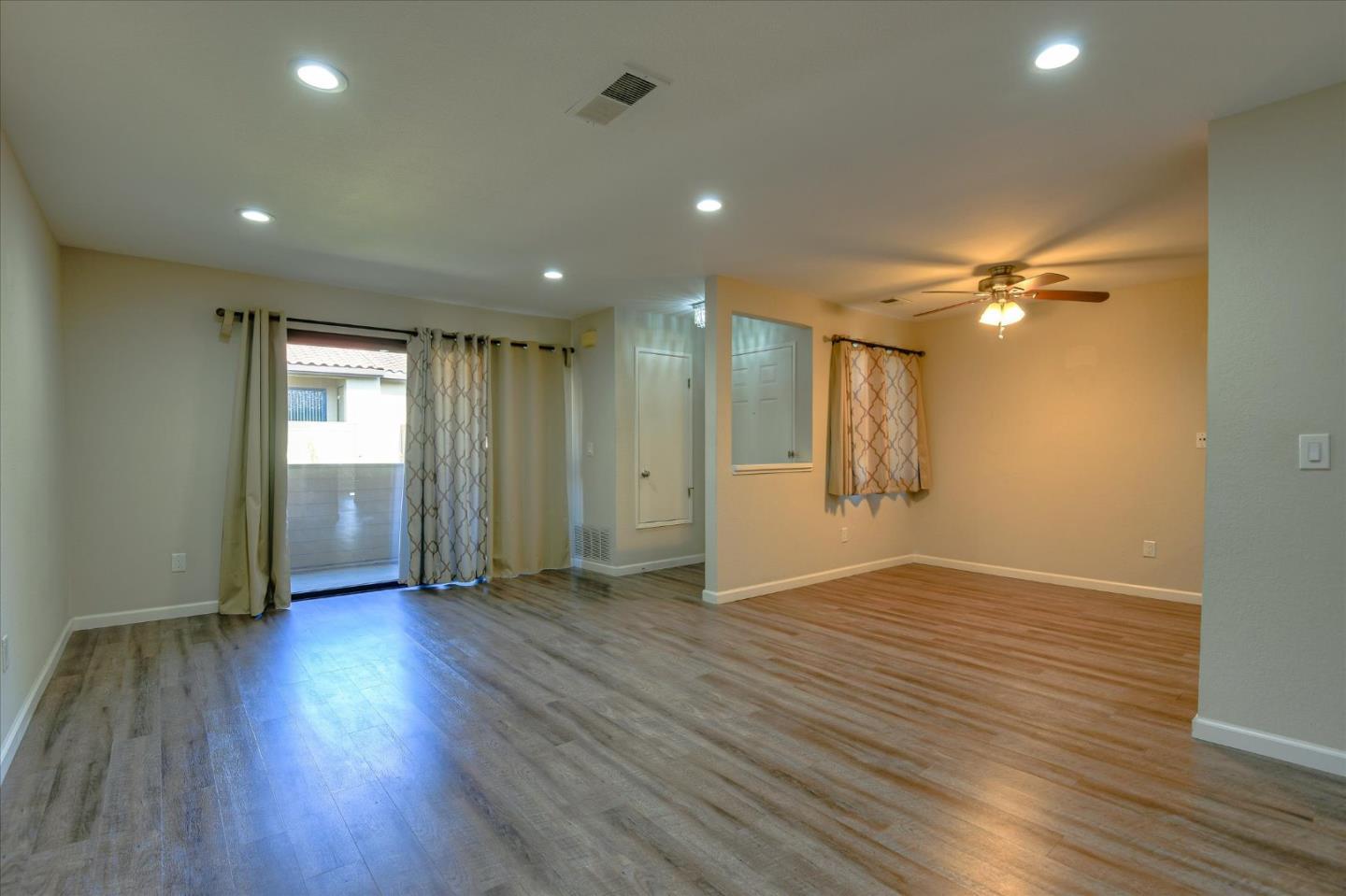 46948 Shale Common, Unit 112 Fremont, CA 94539 - Photo 10 of 30 a view of an empty room with wooden floor and a window