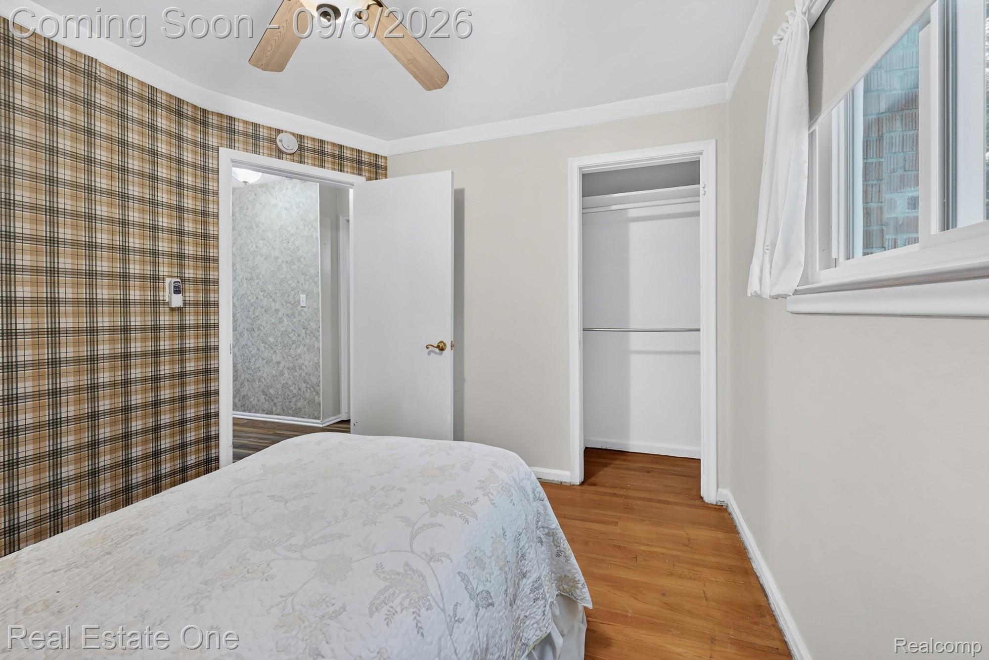 7961 Merrick Street Taylor, MI 48180 - Photo 17 of 39 Wood-finish flooring, white trim, and a ceiling fan