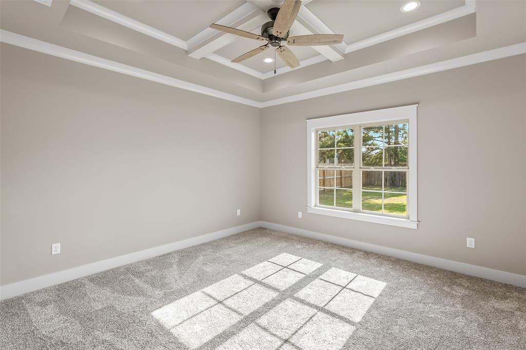 125 Sitka Loop Haughton, LA 71037 - Photo 16 of 29 an empty room with windows and ceiling fan