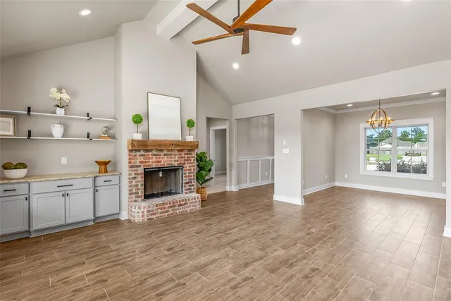 a view of a kitchen with furniture and a fireplace