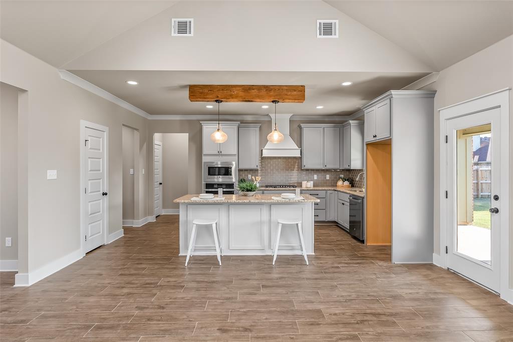 125 Sitka Loop Haughton, LA 71037 - Photo 8 of 29 a living room with stainless steel appliances kitchen island granite countertop furniture and a refrigerator