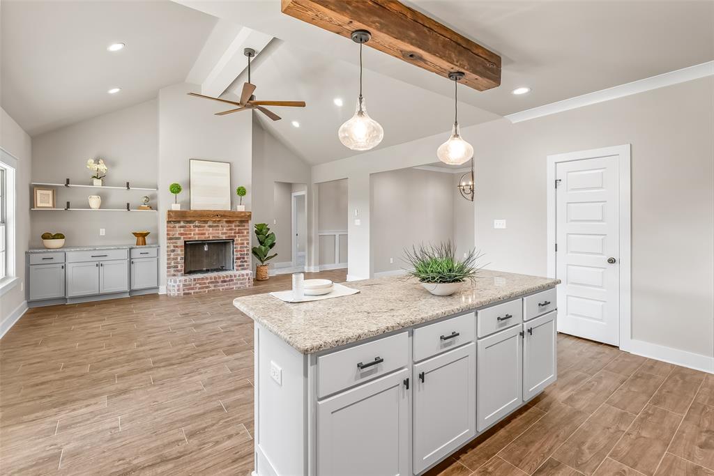 125 Sitka Loop Haughton, LA 71037 - Photo 9 of 29 a kitchen with kitchen island a counter space a sink appliances and cabinets