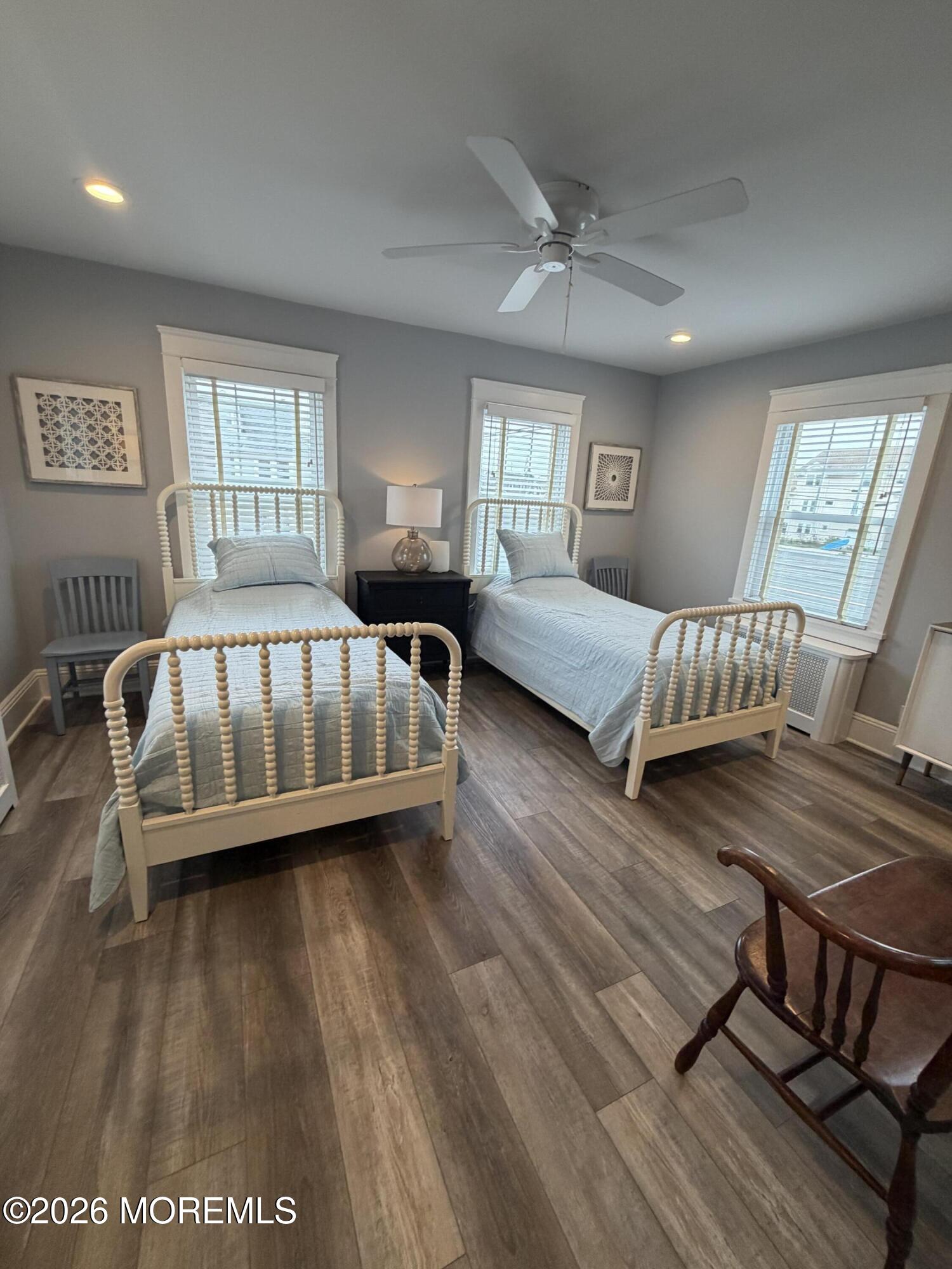 67 E Street Seaside Park, NJ 08752 - Photo 12 of 26 a view of a bedroom with furniture window and wooden floor
