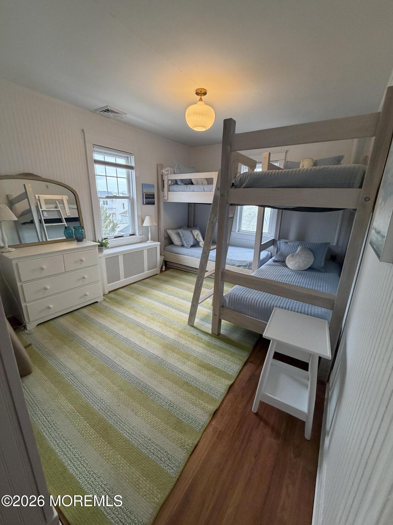 67 E Street Seaside Park, NJ 08752 - Photo 16 of 26 a bed room with a bed furniture and a window