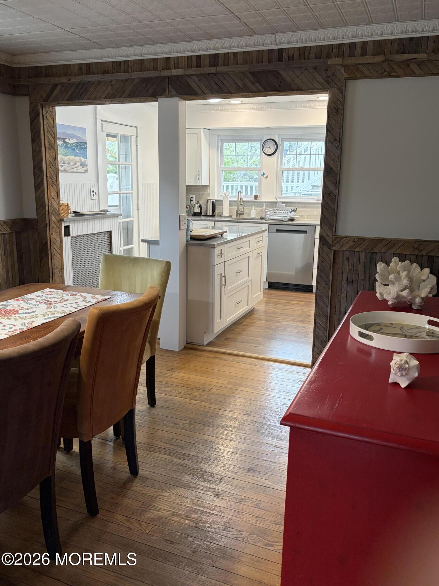 67 E Street Seaside Park, NJ 08752 - Photo 9 of 26 a kitchen with a table chairs and a window