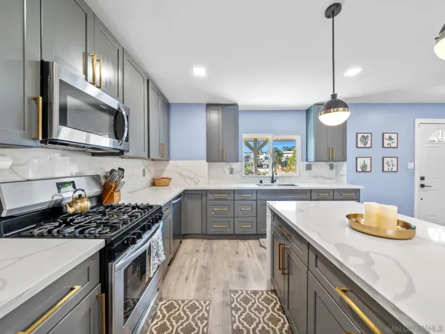 a kitchen with a stove and a sink