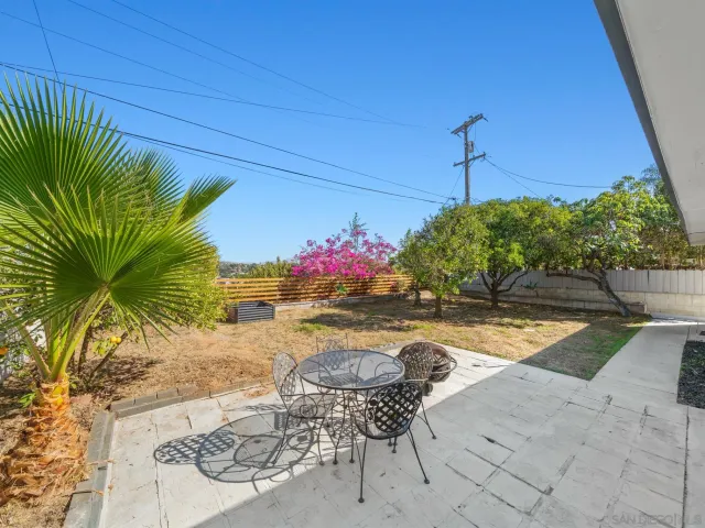 a view of swimming pool with outdoor seating