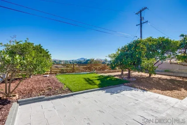 a view of a street with a building in the background