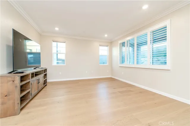 a view of a kitchen with microwave and windows