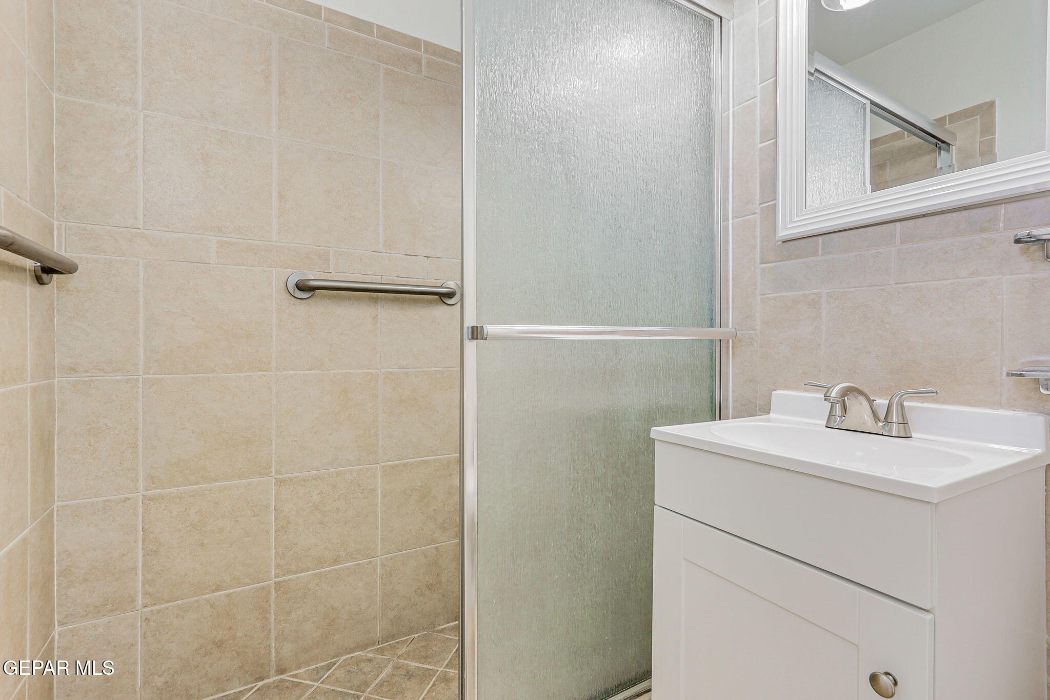 309 Clairemont Road El Paso, TX 79912 - Photo 24 of 40 a bathroom with a sink toilet and vanity