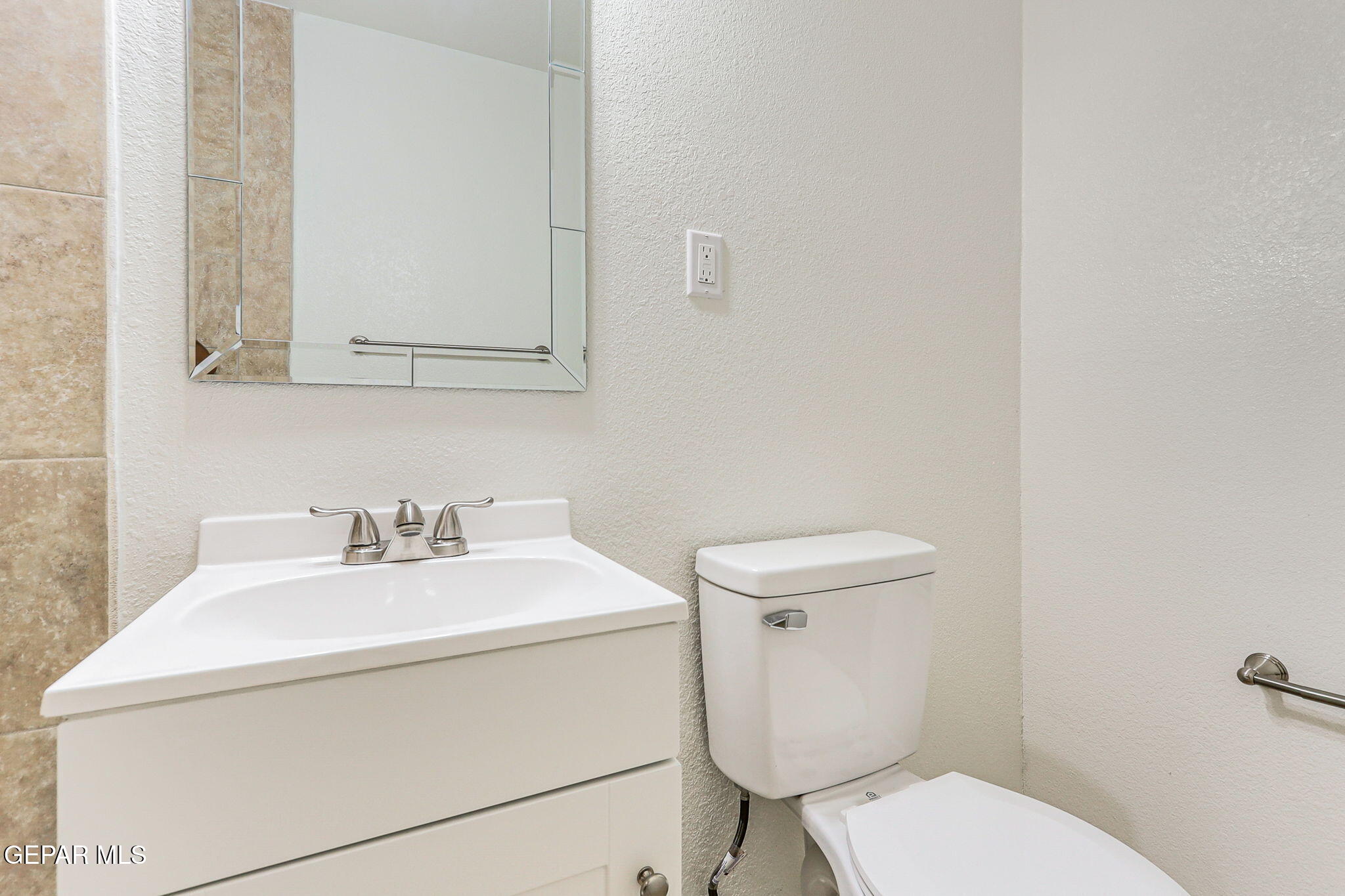 309 Clairemont Road El Paso, TX 79912 - Photo 32 of 40 a bathroom with a toilet sink and mirror