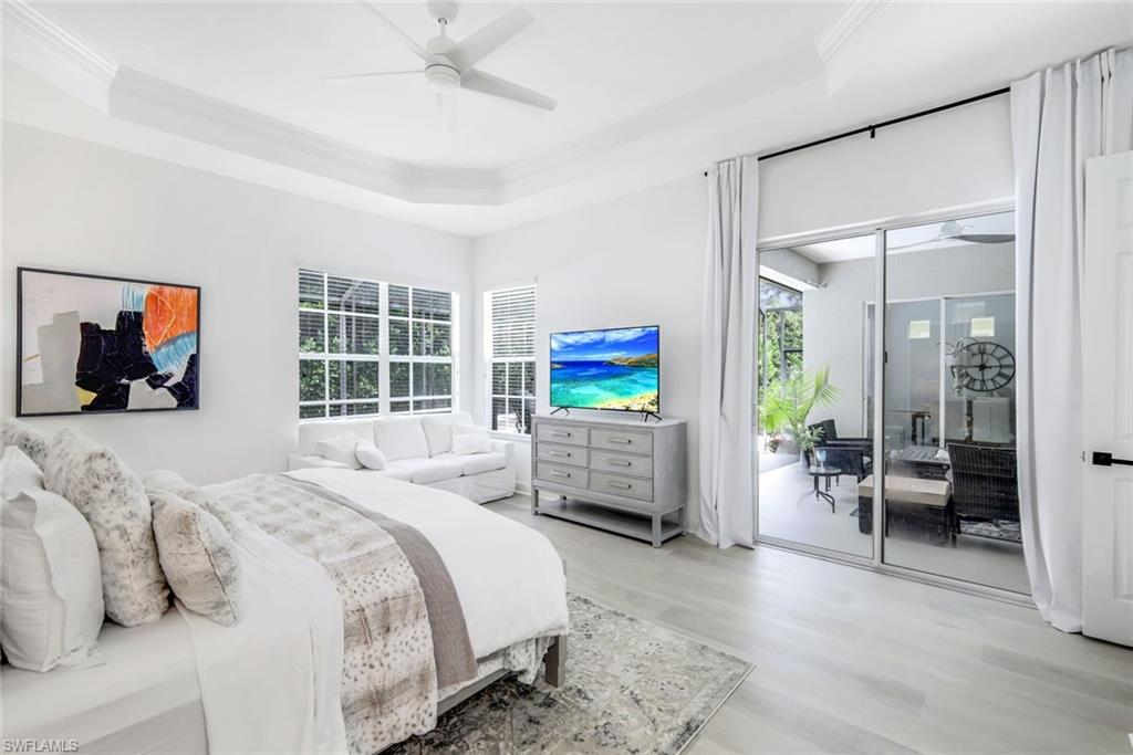 16188 Parque Lane Naples, FL 34110 - Photo 18 of 29 a bedroom with furniture and a flat screen tv