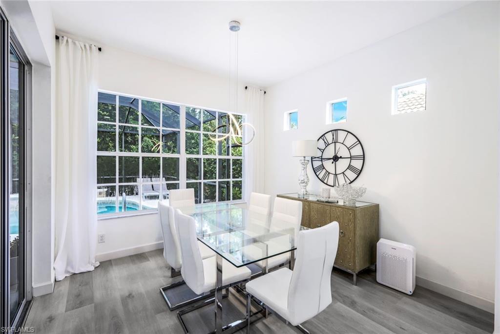 16188 Parque Lane Naples, FL 34110 - Photo 9 of 29 a dining room with furniture and window
